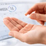 Representative image illustrating the convenience of once-daily oral TYK2 inhibitors like zasocitinib, which achieved PASI 90 and PASI 100 responses by week 16 in plaque psoriasis clinical trials.