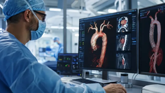 Representative image of a cardiovascular specialist reviewing advanced aortic imaging, reflecting Artivion’s Endospan acquisition strategy and the NEXUS Aortic Arch System opportunity as the company expands its aortic disease portfolio despite a lowered 2026 outlook.