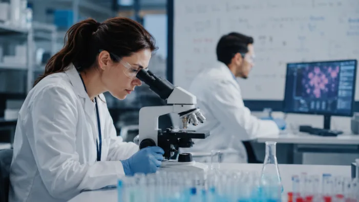 Representative image of oncology researchers studying tumor biology in a modern laboratory, reflecting Exelixis’ CABINET trial data on CABOMETYX and its potential role in advanced neuroendocrine tumor treatment. Can Exelixis defend its oncology franchise with deeper CABINET evidence?