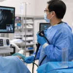Representative image of an advanced endoscopic ultrasound-guided gastrointestinal drainage procedure, reflecting TaeWoong Medical USA’s FDA-cleared SPAXUS stent and the growing role of minimally invasive therapeutic EUS in pancreatic pseudocyst, walled-off necrosis, and high-risk gallbladder drainage care.