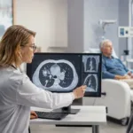 Representative image: An oncologist reviews lung scan images in a modern cancer care setting, reflecting Amgen’s EU approval for Imdylltra in relapsed extensive-stage small cell lung cancer.
