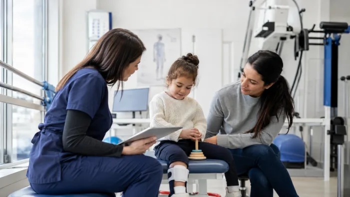 Representative image of a pediatric therapy consultation, illustrating how Biogen’s salanersen breakthrough therapy designation could shape the next phase of spinal muscular atrophy treatment and rare neurology care. Can salanersen help Biogen defend its rare neurology franchise beyond Spinraza?