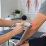 Representative image: Non-invasive elbow therapy highlights MR5 ACTIV PRO’s FDA-cleared role in temporary tennis elbow pain relief.