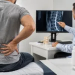 Representative image: A clinician reviews spinal imaging for chronic low back pain as Vertanical’s Exilby approval highlights the growing push for regulated non-opioid pain treatments in Europe.
